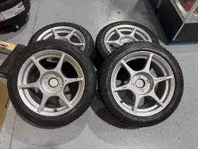 W29076500c5 Kosei 4 Pcs K1 Silver 15x7 4x100 38 With 195/50/15 Tires Mounted And Balanced W29076500c5 Kosei 4 Pcs K1 Silver 15x7 4x100 38 With 195/50/15 Tires Mounted And Balanced