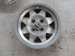 New Momo 6" X 13" Cast Satin Finish Wheel With Bmw Center Cap. Price: $90.00.
