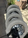 Pre-owned Nissan 16X7 5-LUG Steel Rims W/ Used 216X60X16R Tires. Price: $50.00.